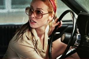 THE LADY IN THE AR WITH GLASSES AND A GUN